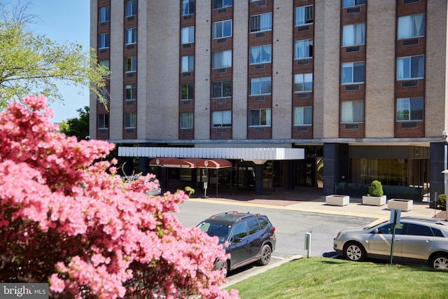 view of property with uncovered parking