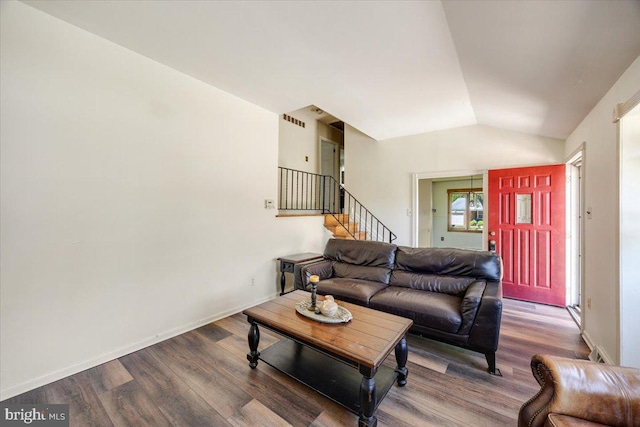 9 Biscayne Blvd, West Deptford, NJ 08096 - living area with visible vents, vaulted ceiling, wood finished floors, and stairway