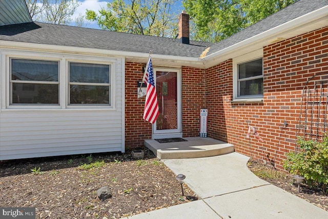 9 Biscayne Blvd, West Deptford, NJ 08096 - entrance to property with a shingled roof, a chimney, and brick siding