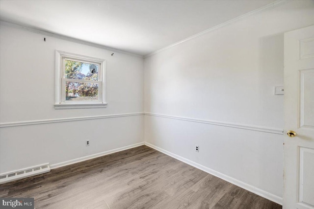 9 Biscayne Blvd, West Deptford, NJ 08096 - unfurnished room with crown molding, a baseboard radiator, baseboards, and wood finished floors