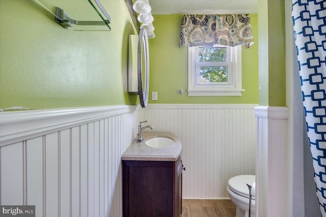 9 Biscayne Blvd, West Deptford, NJ 08096 - bathroom featuring vanity, a wainscoted wall, toilet, and wood finished floors