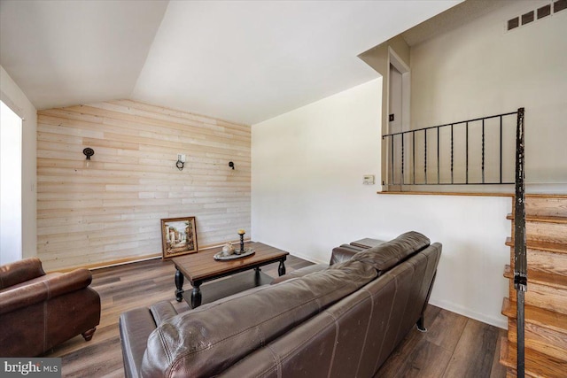 9 Biscayne Blvd, West Deptford, NJ 08096 - living room with visible vents, wood finished floors, wooden walls, stairway, and vaulted ceiling