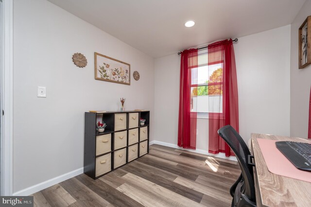 home office featuring baseboards, recessed lighting, and wood finished floors