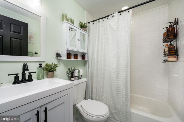 bathroom featuring vanity, toilet, and shower / bath combination with curtain
