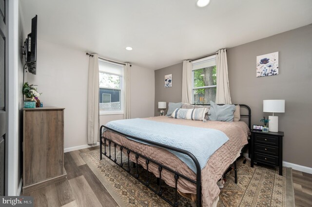 bedroom featuring recessed lighting, baseboards, and wood finished floors