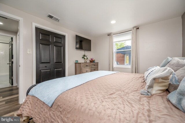 bedroom featuring recessed lighting, visible vents, and wood finished floors