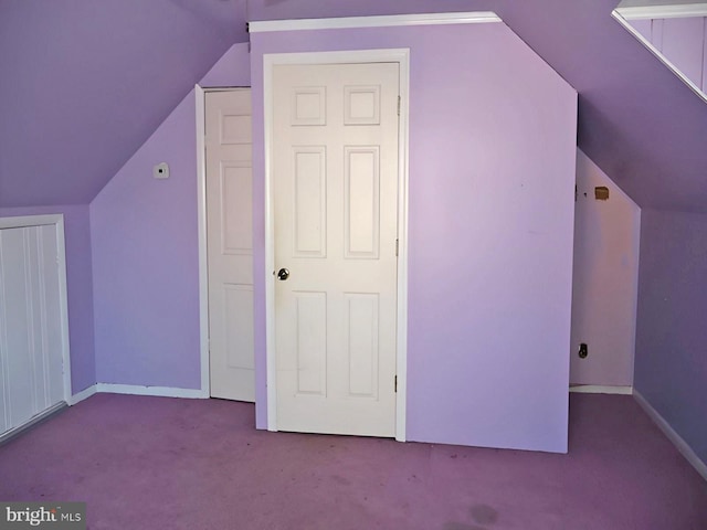 bonus room featuring vaulted ceiling, baseboards, and carpet flooring