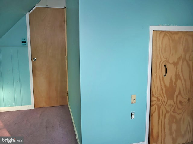 interior space with carpet floors and baseboards