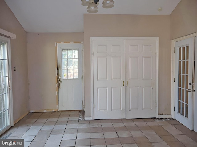 foyer featuring light tile patterned floors