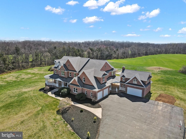 view of subject property featuring a heavily wooded area