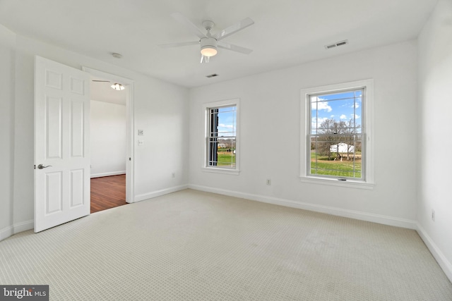 unfurnished bedroom featuring carpet flooring, baseboards, and ceiling fan