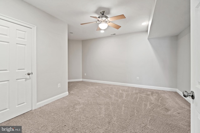 empty room with carpet, a ceiling fan, baseboards, and recessed lighting