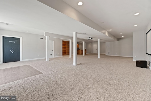 finished basement with baseboards, recessed lighting, and carpet