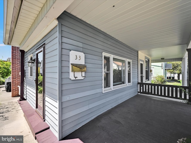 view of side of property featuring a porch