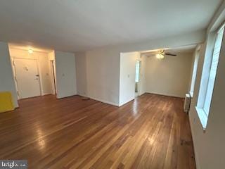 unfurnished room featuring ceiling fan and wood finished floors