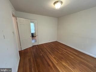 2702 30th St SE Unit A250, Washington, DC 20020 - unfurnished bedroom featuring wood finished floors