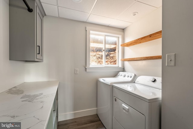 laundry room featuring laundry area, baseboards, washer and dryer, and dark wood-style floors