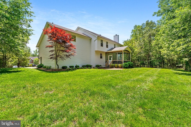 22982 Sheffield Ct, Hollywood, MD 20636 - view of front of property featuring a sunroom, a chimney, and a front yard