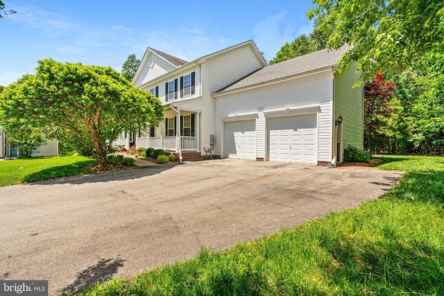 22982 Sheffield Ct, Hollywood, MD 20636 - view of front facade featuring a porch, an attached garage, driveway, and a front yard