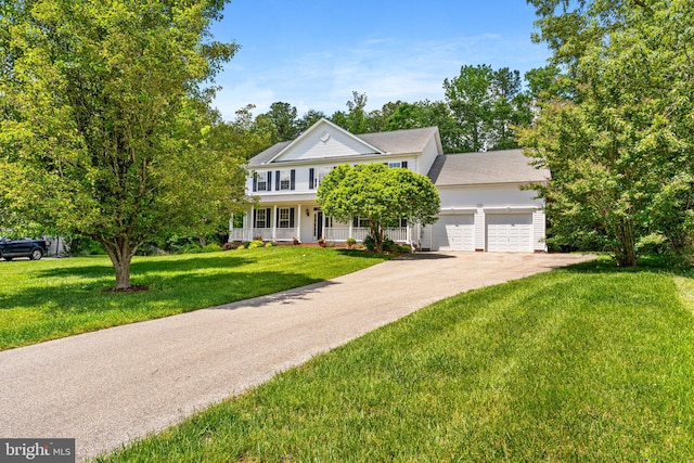 22982 Sheffield Ct, Hollywood, MD 20636 - traditional-style home with an attached garage, a front lawn, covered porch, and driveway