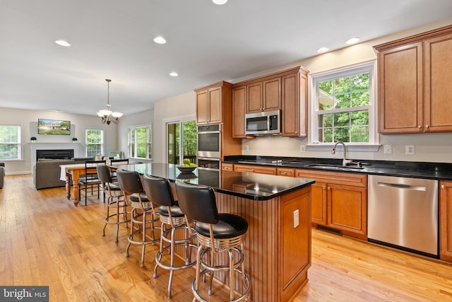 22982 Sheffield Ct, Hollywood, MD 20636 - kitchen featuring appliances with stainless steel finishes, a sink, plenty of natural light, light wood-style flooring, and recessed lighting