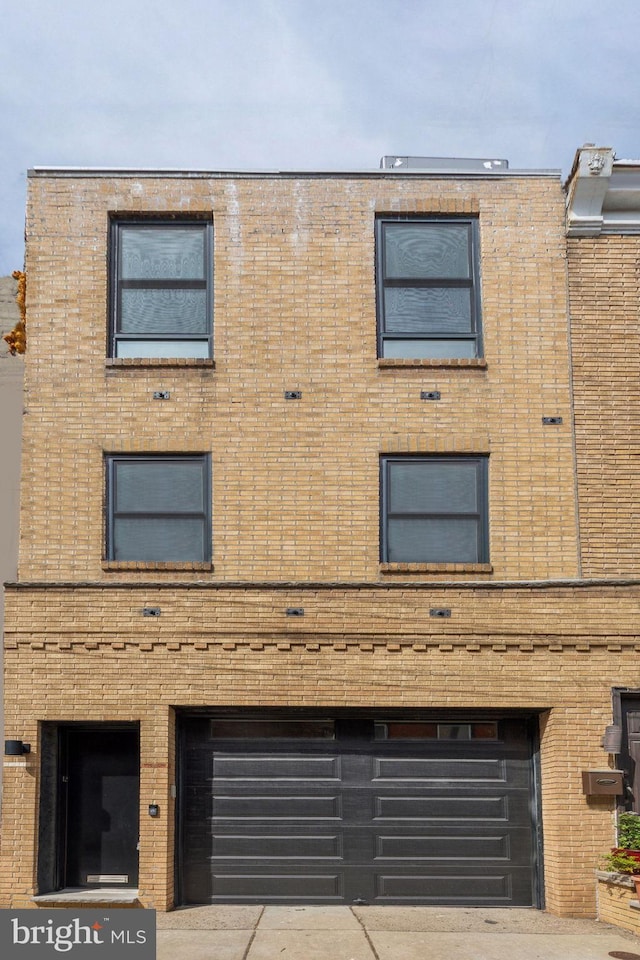 1211 Annin St, Philadelphia, PA 19147 - view of property featuring driveway and a garage