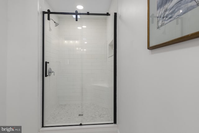 full bathroom with a shower stall and recessed lighting