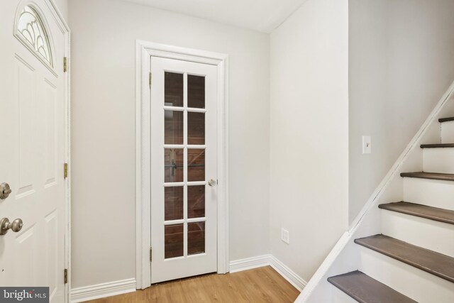 4 Virginia Rd, Glassboro, NJ 08028 - doorway featuring light wood-type flooring, stairs, and baseboards