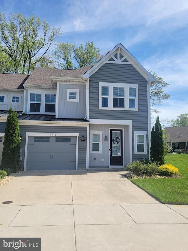 view of front facade featuring a garage, board and batten siding, and concrete driveway
