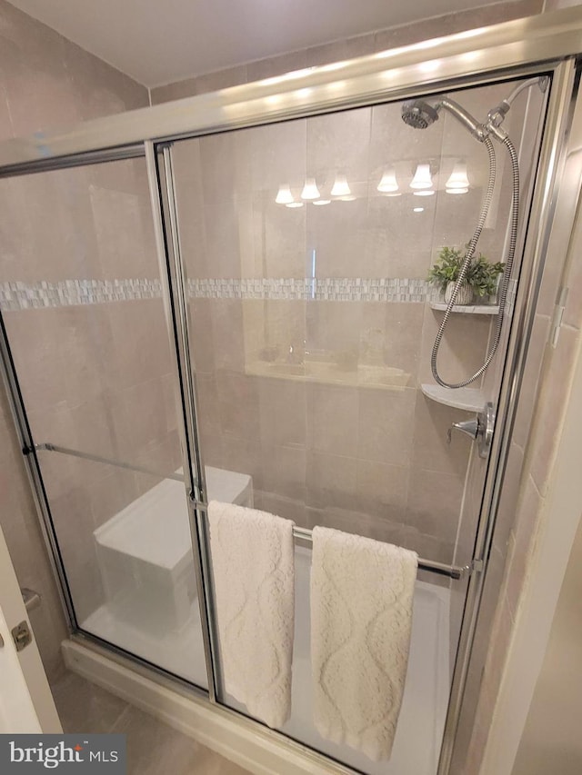bathroom featuring a stall shower