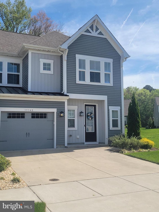 view of front facade with a garage, board and batten siding, and concrete driveway