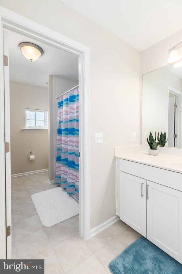 39348 Owls Nest Ln, Millville, DE 19967 - full bathroom with vanity, baseboards, tile patterned floors, and a shower with shower curtain