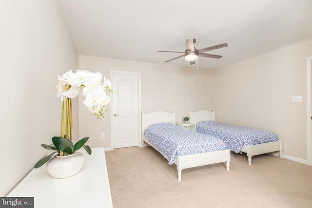 39348 Owls Nest Ln, Millville, DE 19967 - bedroom with baseboards, a ceiling fan, and light colored carpet
