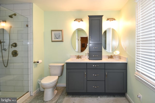 3505 Fox Ridge Rd, Waldorf, MD 20601 - bathroom with a shower stall, toilet, baseboards, and double vanity