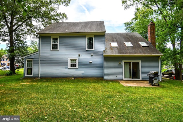 3505 Fox Ridge Rd, Waldorf, MD 20601 - rear view of house featuring a lawn, a chimney, a patio, and roof with shingles
