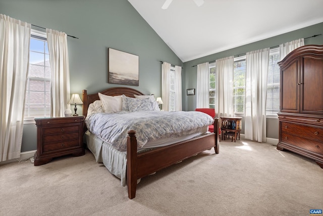 bedroom featuring baseboards, light colored carpet, ceiling fan, and high vaulted ceiling