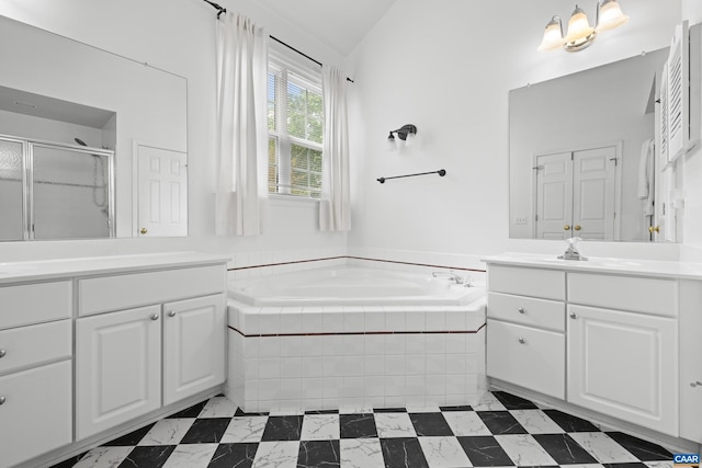 full bath with two vanities, a sink, a bath, and a stall shower