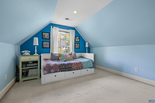 bedroom with visible vents, carpet, baseboards, and vaulted ceiling