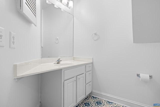 bathroom with baseboards and vanity