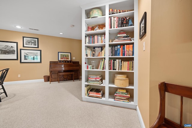 living area featuring recessed lighting, baseboards, visible vents, and carpet
