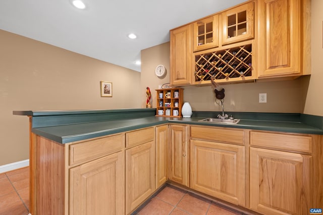 bar featuring recessed lighting, wet bar, a sink, and light tile patterned floors