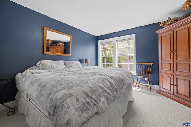 carpeted bedroom with baseboards