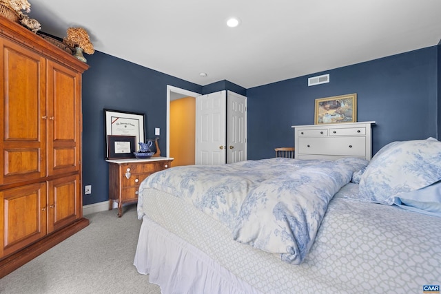 bedroom featuring baseboards, light colored carpet, recessed lighting, and visible vents