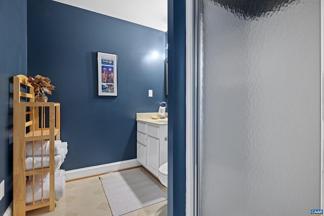 bathroom with vanity and baseboards