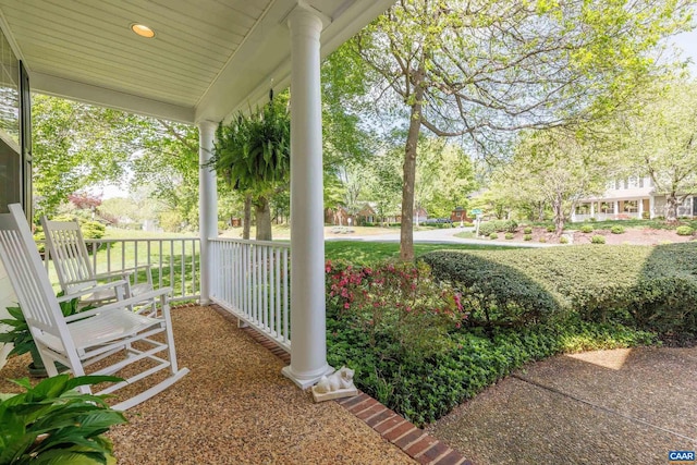 view of yard featuring covered porch