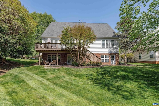 back of house with stairway, a lawn, and a wooden deck