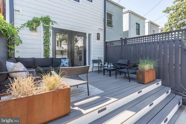 430 15th St SE, Washington, DC 20003 - wooden deck featuring fence, an outdoor living space, and french doors