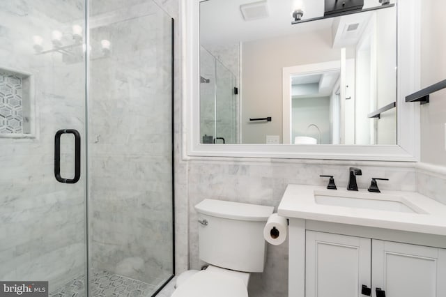 430 15th St SE, Washington, DC 20003 - bathroom featuring toilet, tile walls, a shower stall, and vanity
