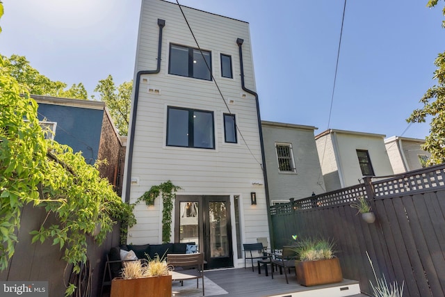 430 15th St SE, Washington, DC 20003 - back of property with fence, french doors, and an outdoor hangout area