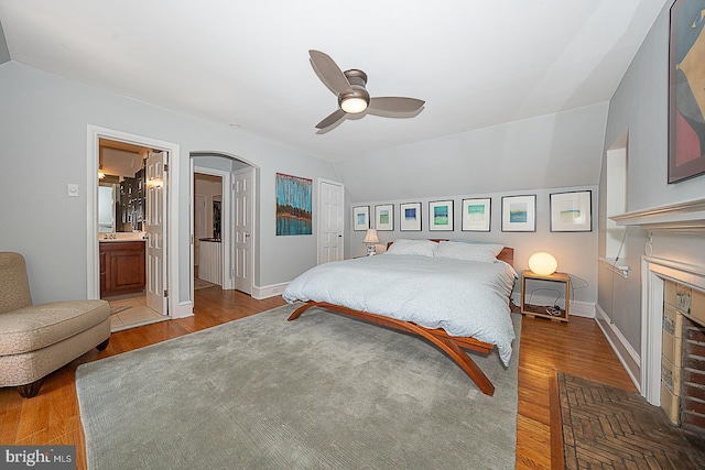 701 Argyle Rd, Wynnewood, PA 19096 - bedroom featuring wood finished floors, baseboards, a fireplace, and ensuite bath